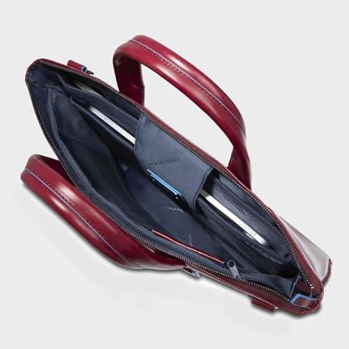Sac cartable rouge en cuir avec compartiment laptop ouvert
